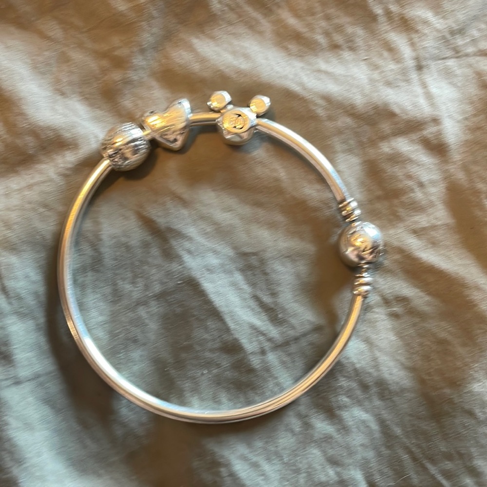 Pandora charm bangle with 3 Disney Parks charms